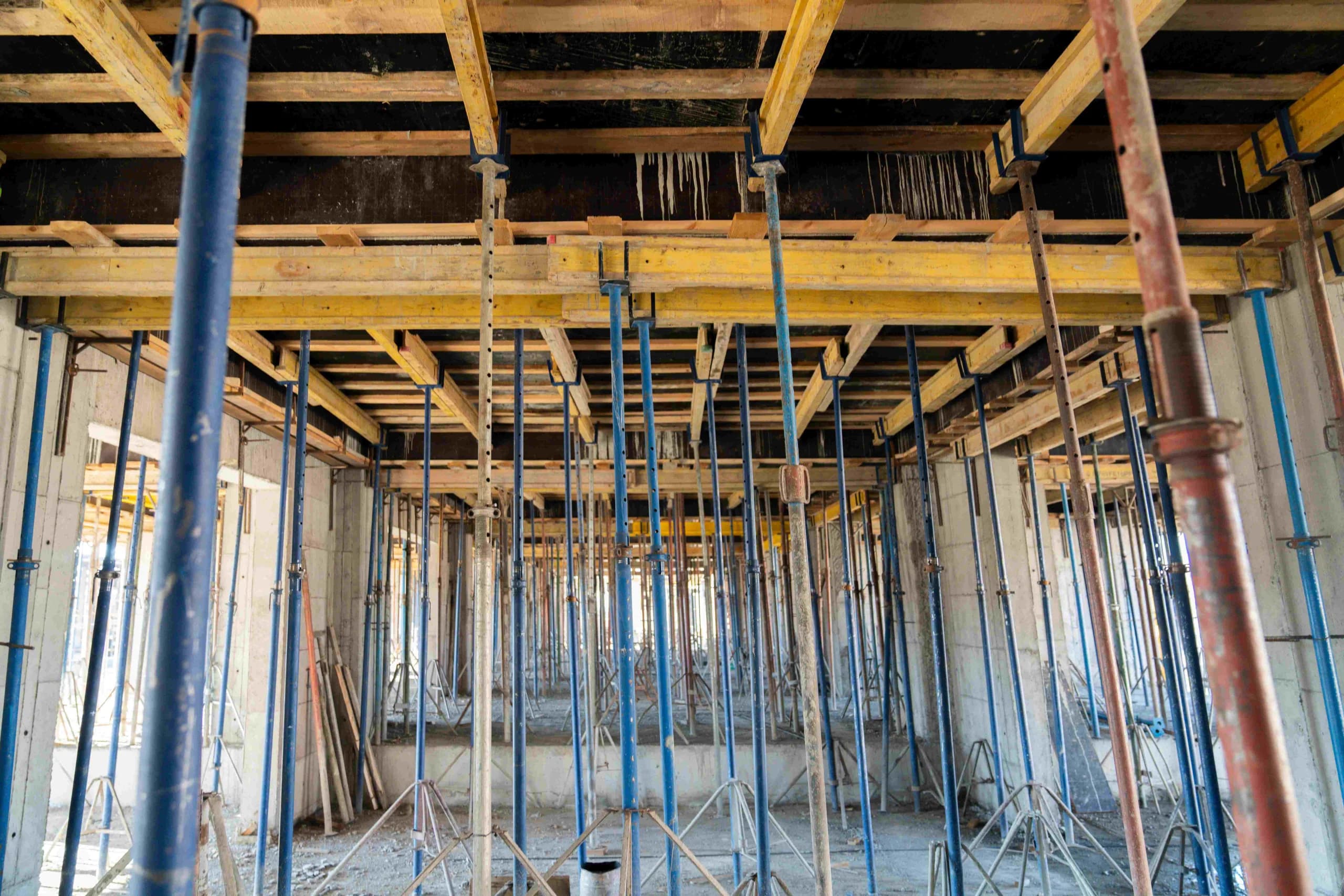 Concrete crew preparing rebar and formwork