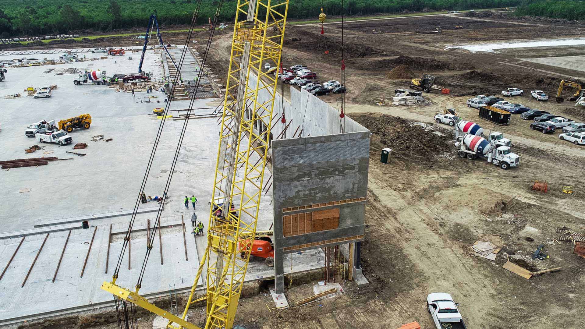 Concrete boom pump placing a commercial foundation in Tyler